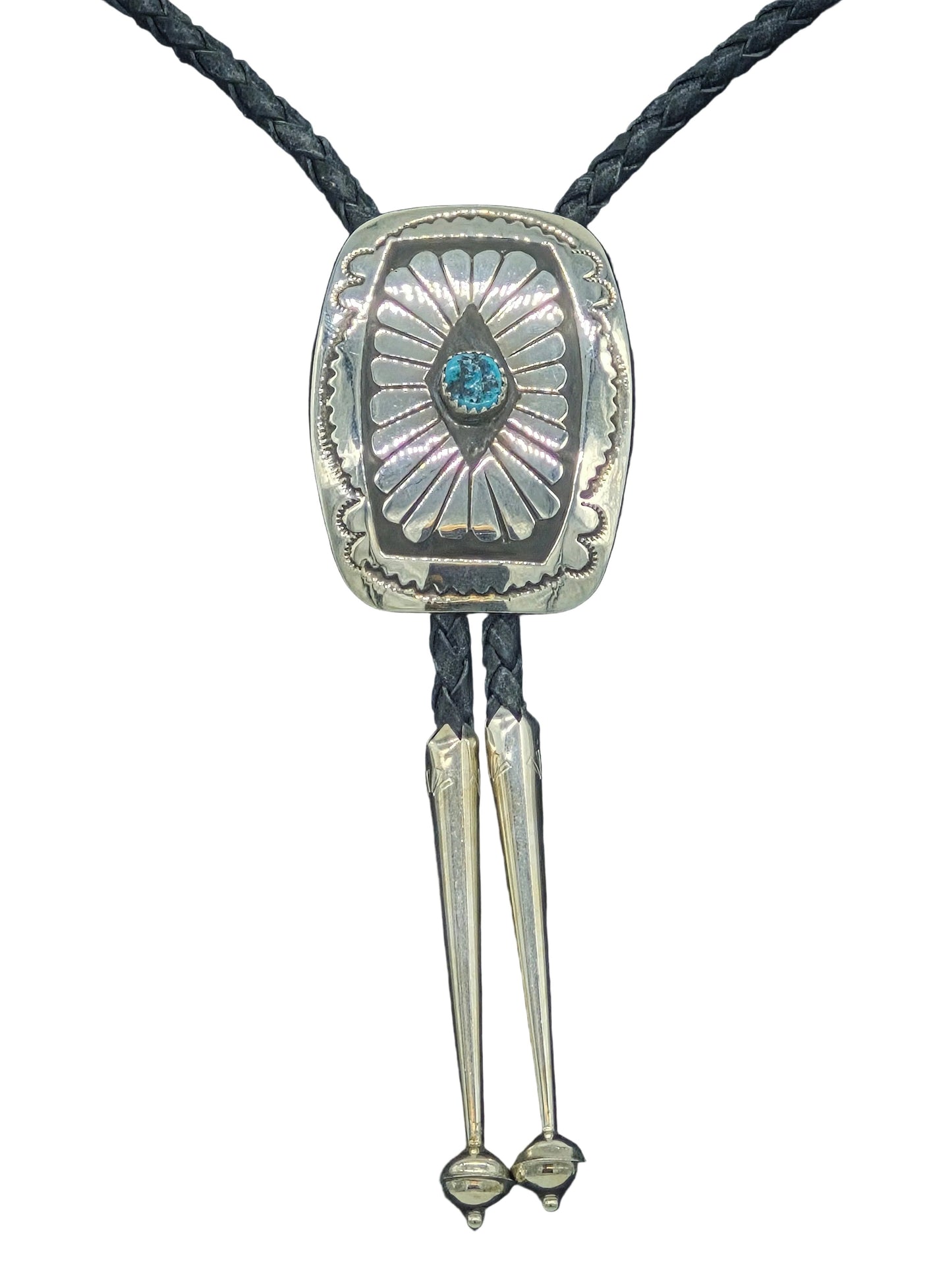 Navajo sterling silver concho bolo tie with hand-stamped sunburst design and turquoise center stone