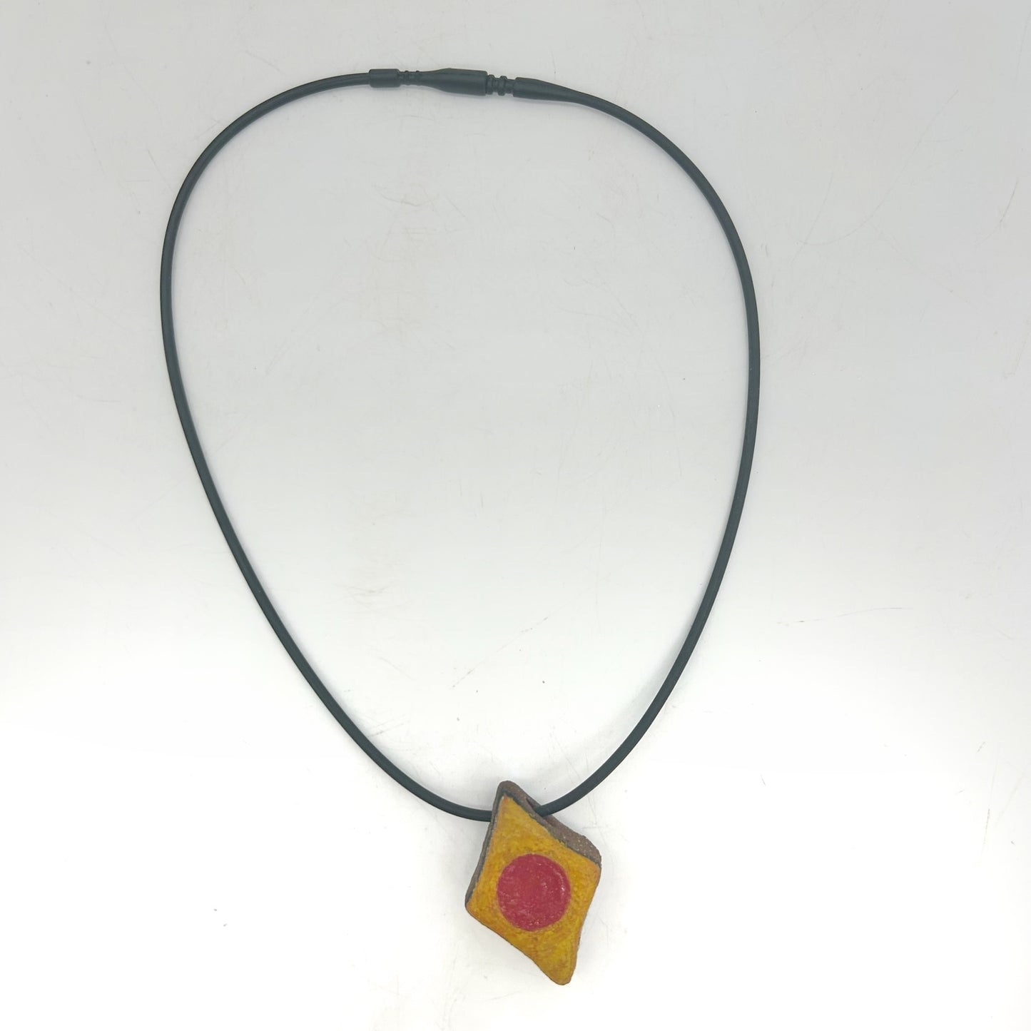 Lisa Smith ~ Ceramic Red Dot Pendant Necklace, reversible 1 1/4" x 1" x 1/2" on 16"